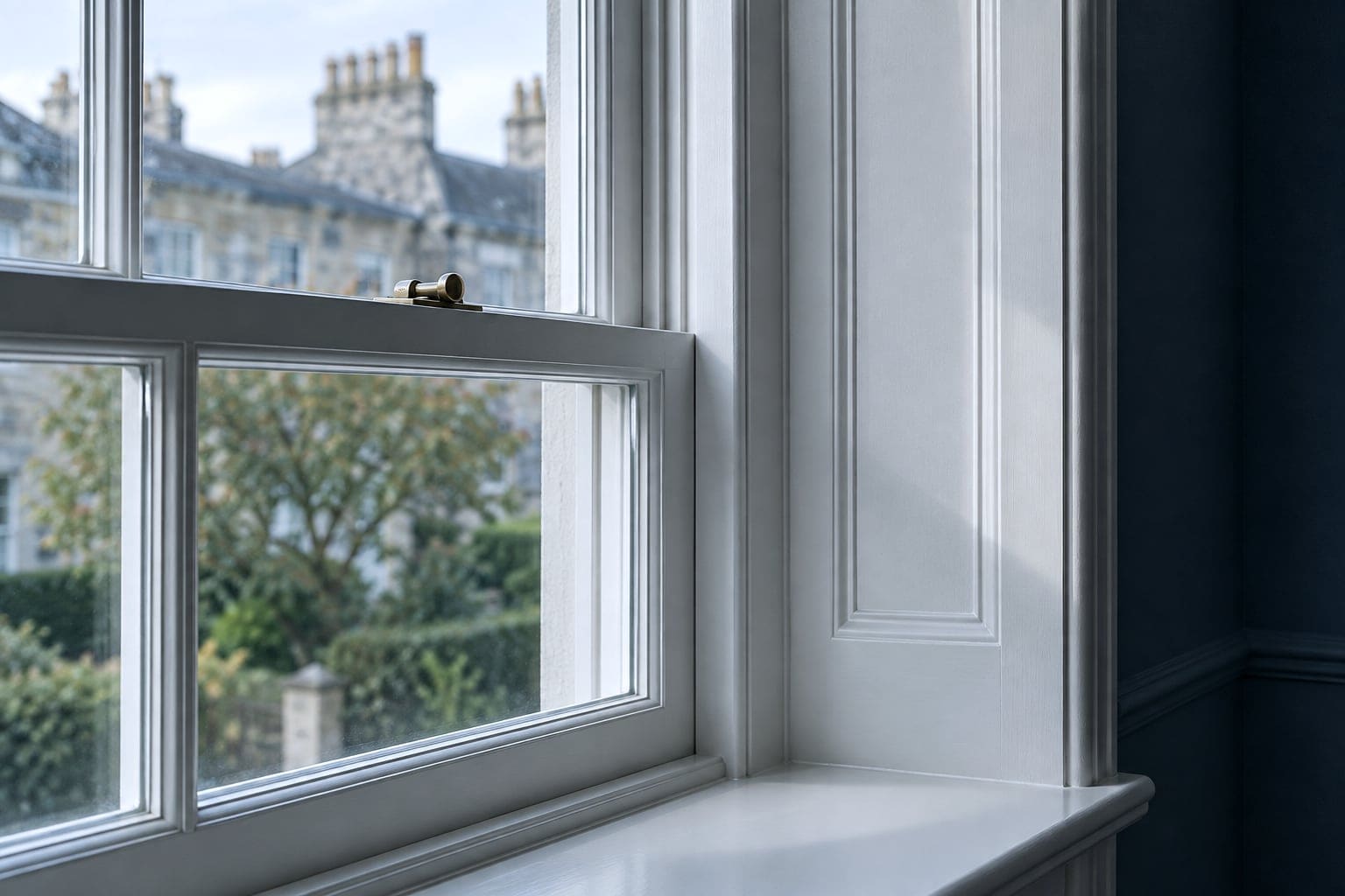 Newly installed bespoke timber sash window in a freshly painted reveal